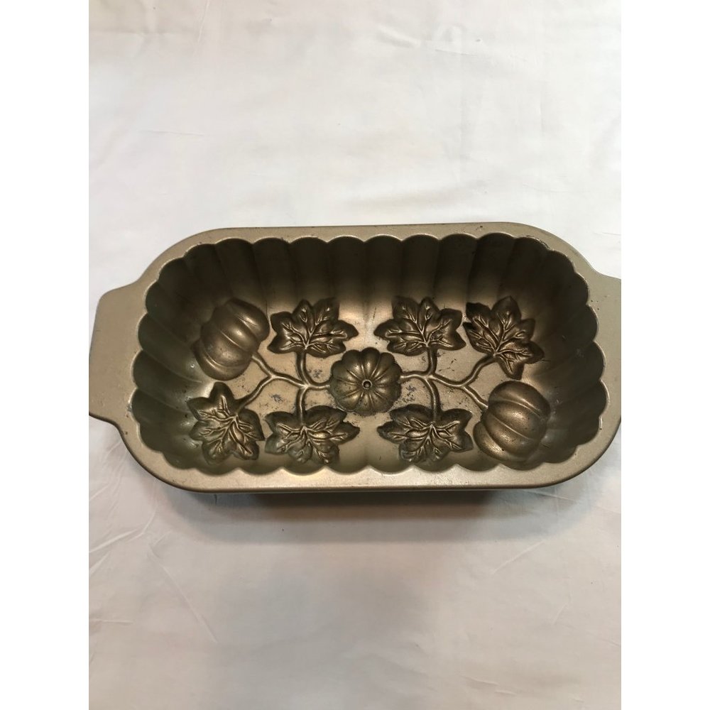 Nordic Ware 13”x61:2” cast aluminum pumpkin patch loaf pan. Made U.S.A.